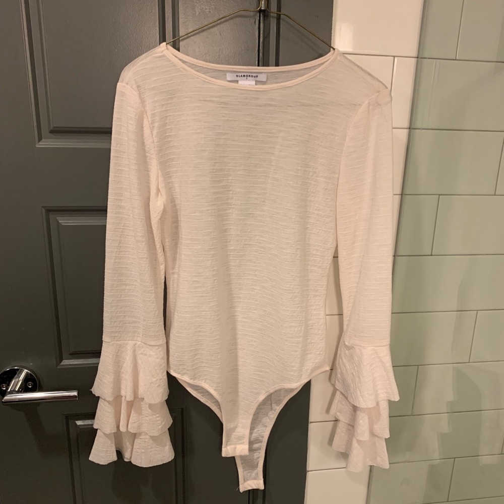 Pale/ cream pink body suite with ruffle sleeves